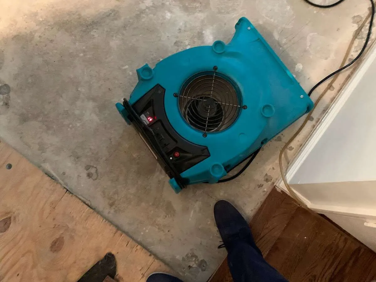 Air mover drying subfloor during Commercial Water Damage Restoration in Cherokee Village